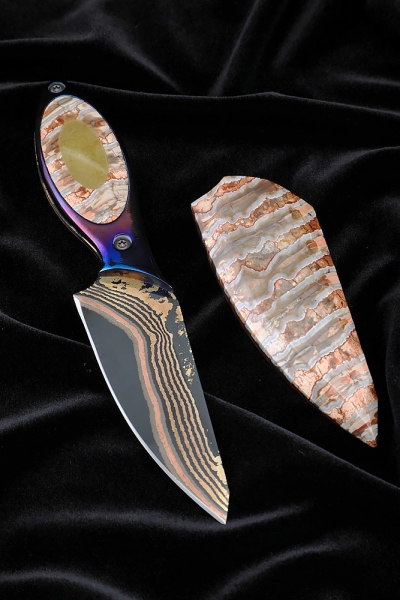 Author's knife Dilong made of laminated damascus, titanium handle, stabilized mammoth tooth and amber