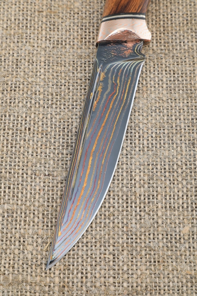 Exclusive knife Gadfly made of laminated damascus, handle material mokume-gane iron wood