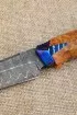 Нож Алькор дамаск ламинированный рукоять и ножны карельская береза янтарь, зубы мамонта на подставке