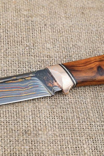 Exclusive knife Gadfly made of laminated damascus, handle material mokume-gane iron wood