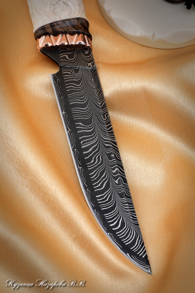 Knife Chief Damascus end mokume-gane moose horn carved on a stand