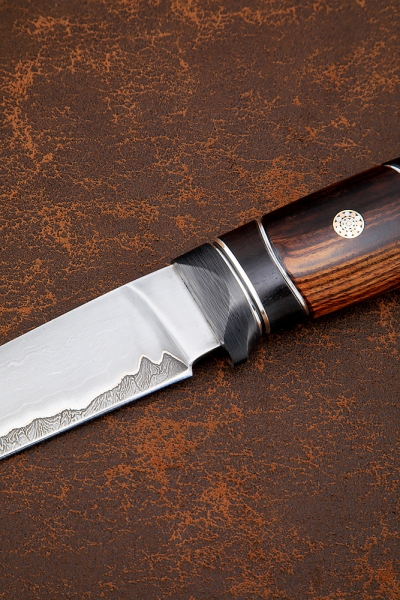Damascus laminated leopard knife, black hornbeam, iron wood, carbon