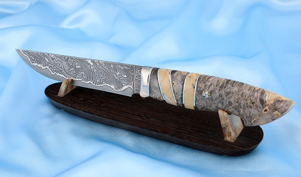 Knife Zasapozhny Damascus laminated Karelian birch mammoth bone mokume-gane on a stand