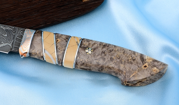 Knife Zasapozhny Damascus laminated Karelian birch mammoth bone mokume-gane on a stand
