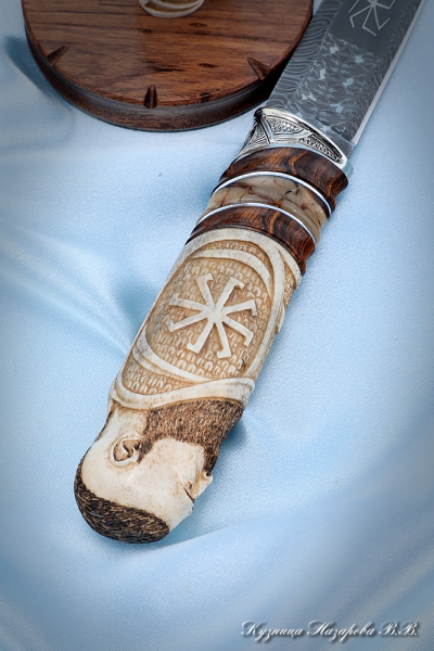 Knife Kolovrat Damascus end bone of a mammoth iron wood, nickel silver on a stand