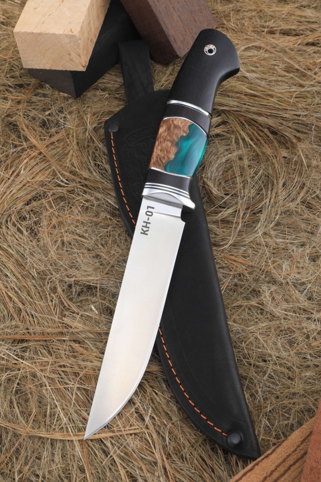 The knife is Zasapozhny KN-01 handle black hornbeam Karelian birch acrylic green