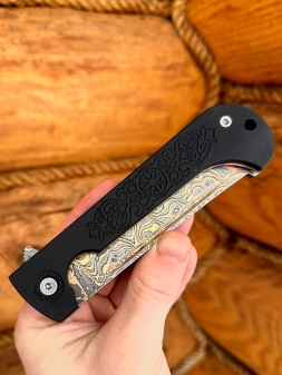 Folding knife Pocket laminated damascus steel with copper,G 10 black lining with ornament