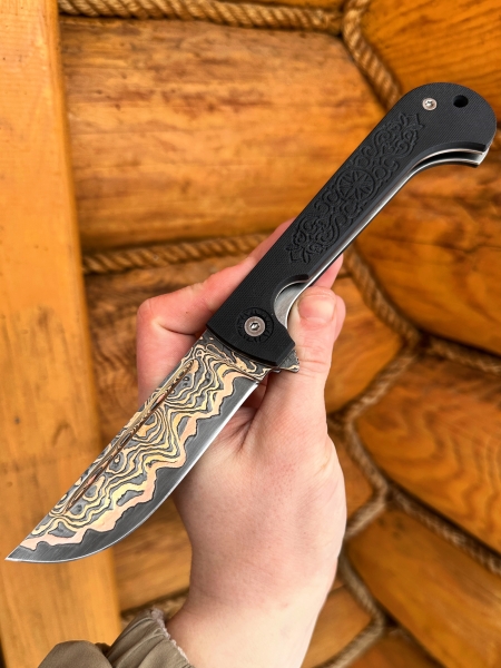 Folding knife Pocket laminated damascus steel with copper,G 10 black lining with ornament