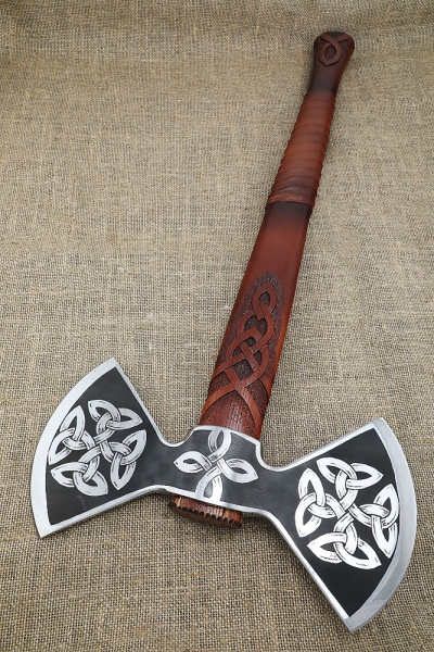 Axe-axe with a carved ash pattern on a stand