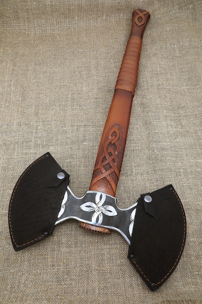 Axe-axe with a carved ash pattern on a stand
