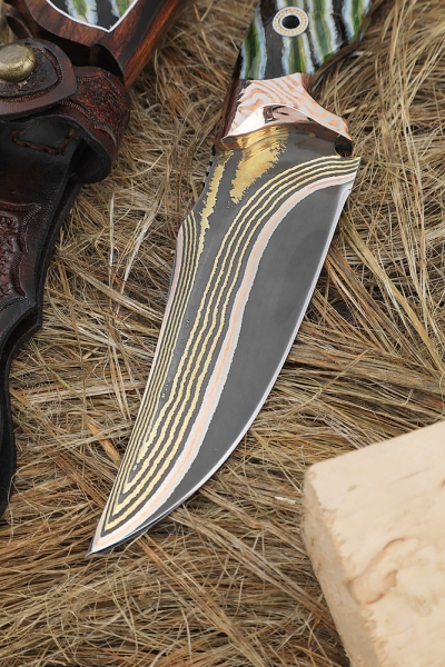 Exclusive knife Kid Damascus in all-metal laminate, overlays mammoth tooth and iron wood