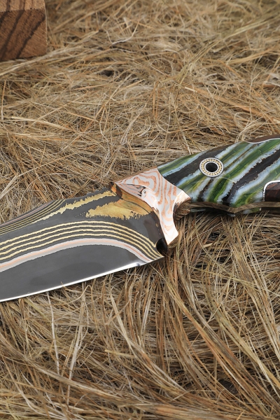 Exclusive knife Kid Damascus in all-metal laminate, overlays mammoth tooth and iron wood