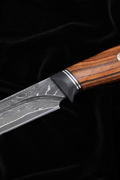 The knife Irbis Damascus laminated with a dole of iron wood